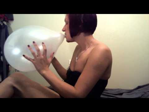 Domino Damoiselle blows up balloon