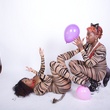 Molly Noire pops balloons naked