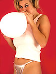 Victoria sits on balloons naked